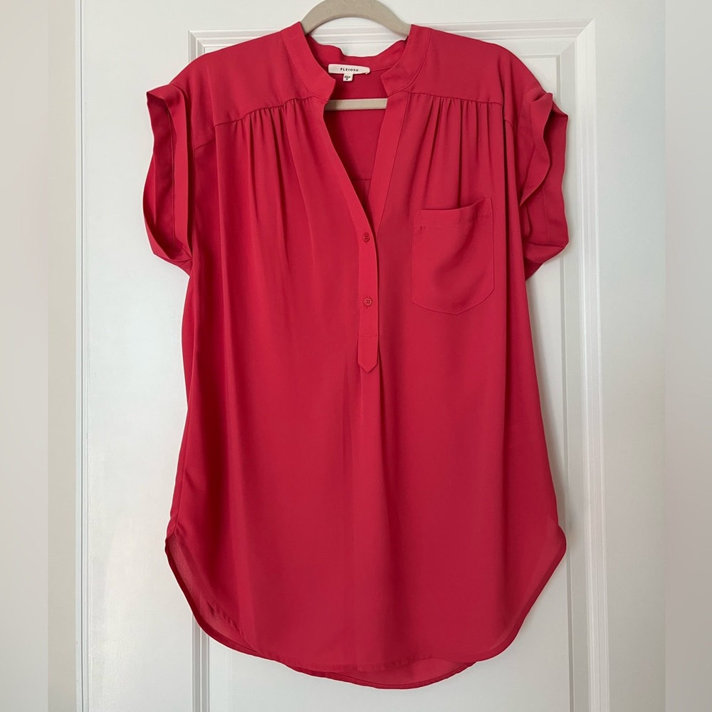 Pink longer style top.